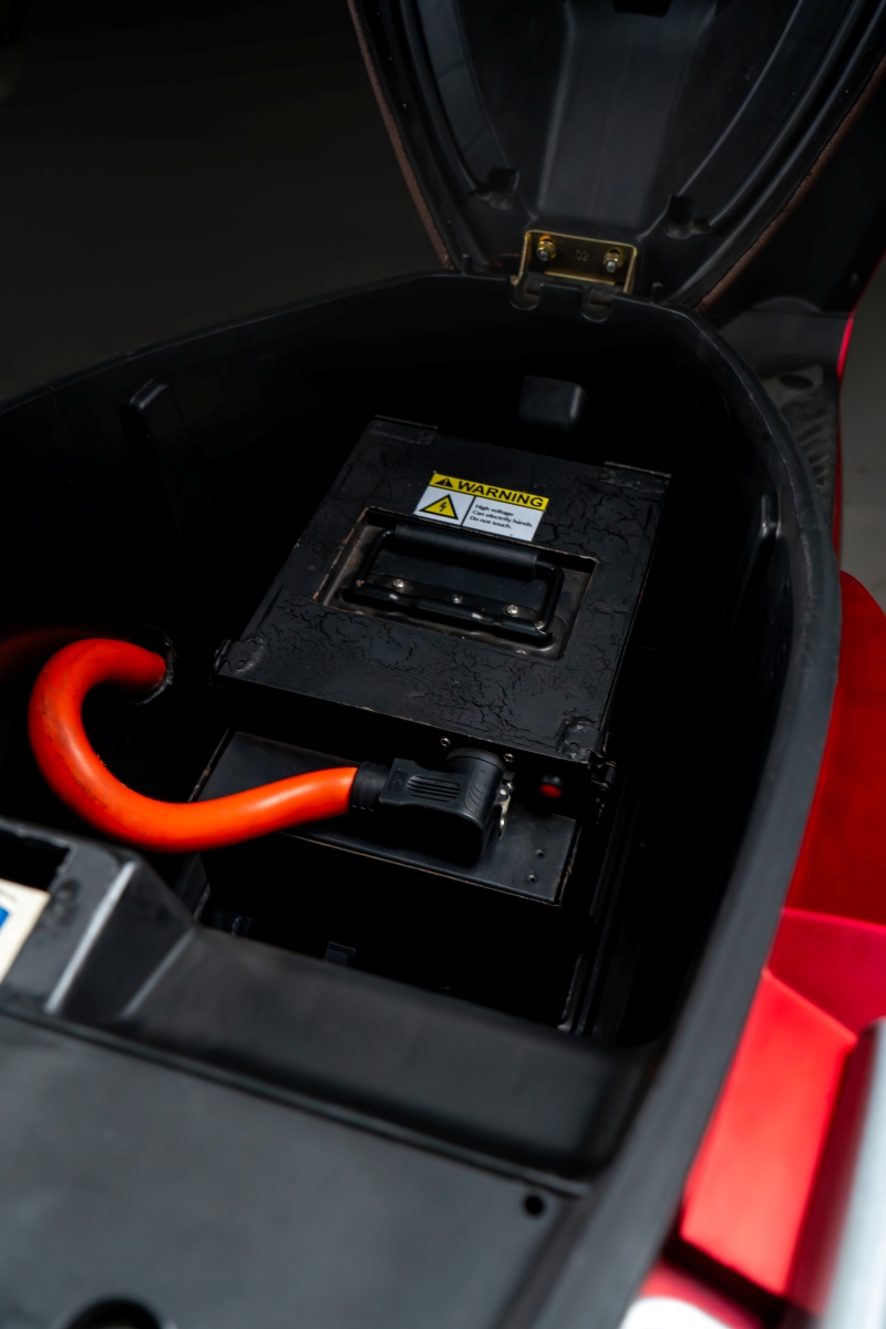 Beats under-seat battery in a red motorcycle