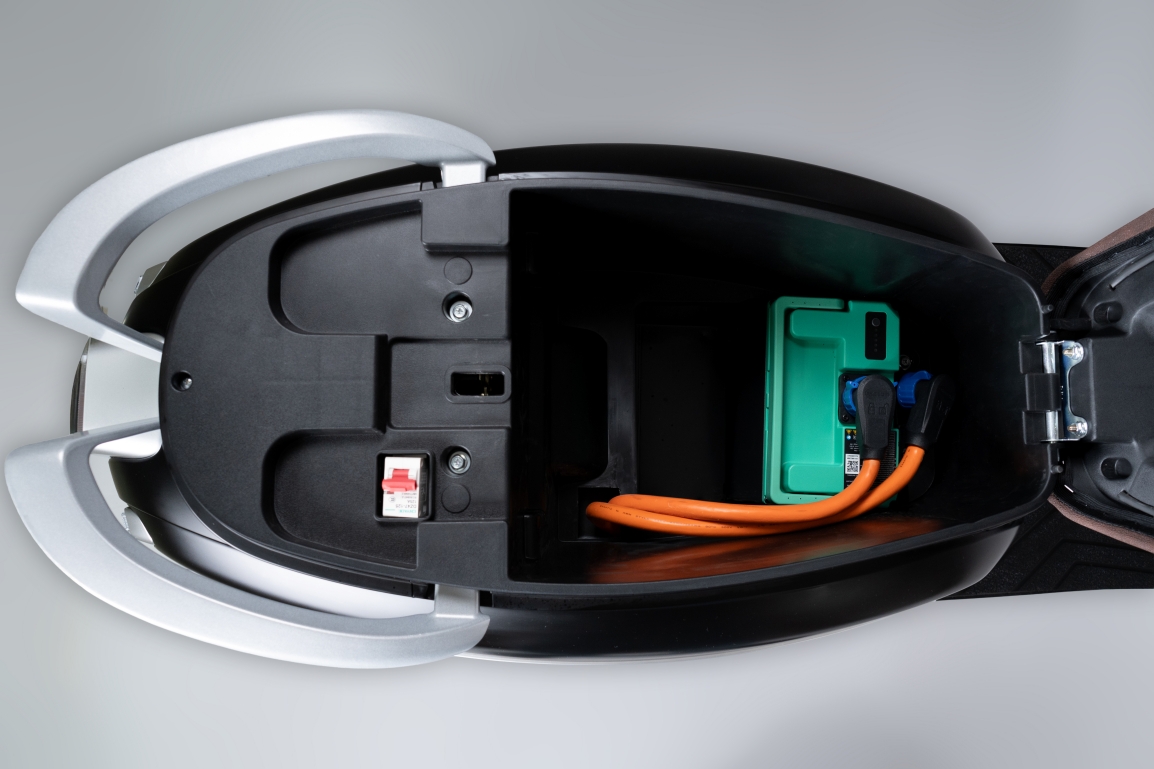 Goddess under-seat battery compartment